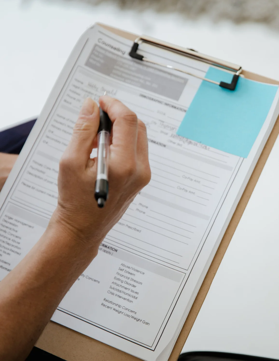 Patient completing new patient forms
